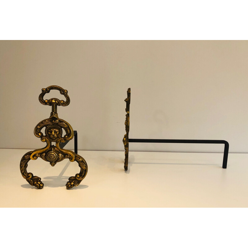 Coppia di candelabri d'epoca in bronzo e ferro battuto con teste di leone, 1940