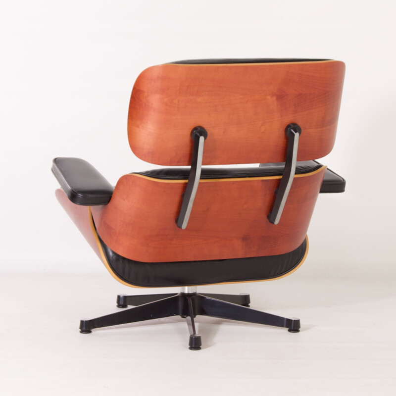 Vintage armchair with ottoman by Charles & Ray Eames for Vitra, 1990s