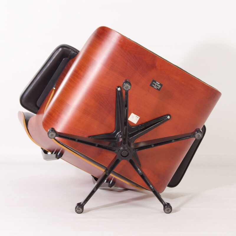 Vintage armchair with ottoman by Charles & Ray Eames for Vitra, 1990s