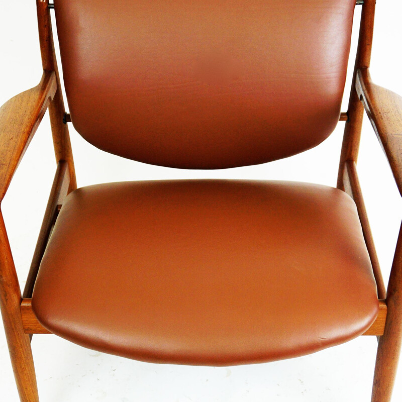 Vintage Deense fauteuil in teak en bruin leer van Finn Juhl voor France et Son