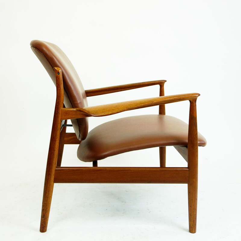 Vintage Deense fauteuil in teak en bruin leer van Finn Juhl voor France et Son