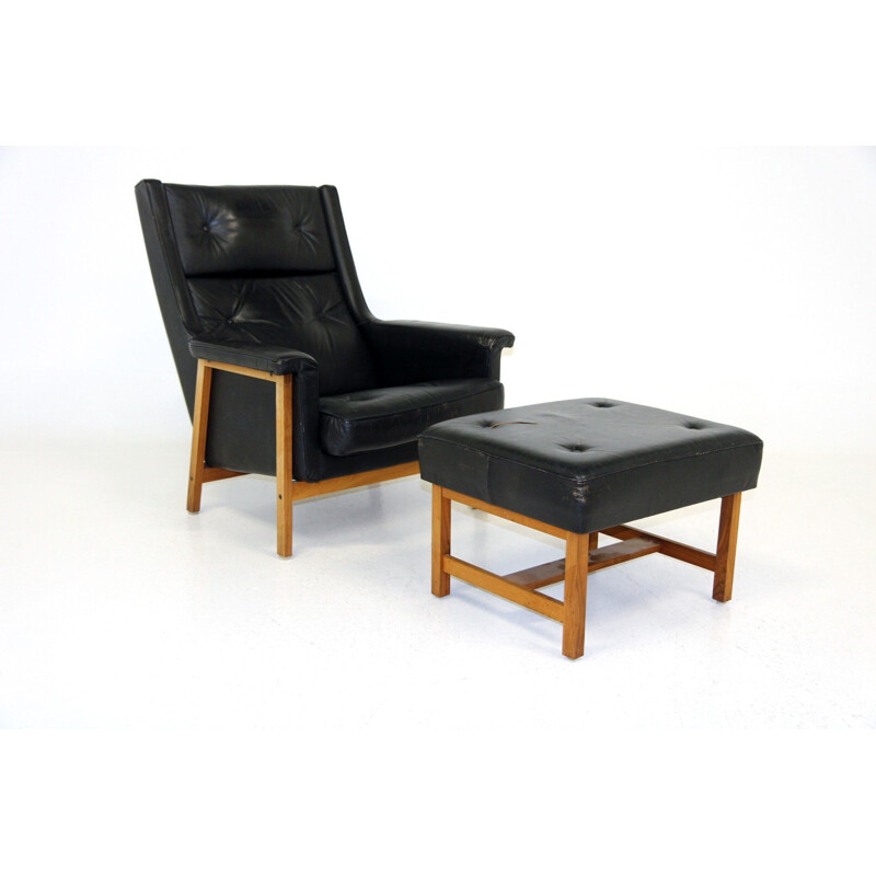 Vintage leather armchair with footrest by Karl Erik Ekselius, Sweden 1960