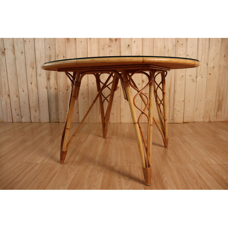 Vintage round table in rattan by Audoux Minet
