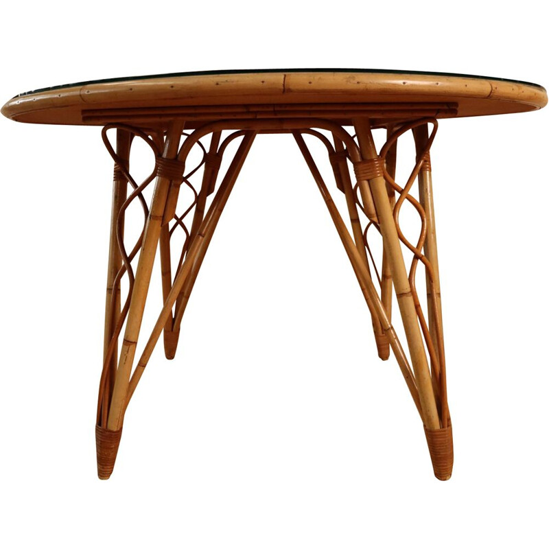 Vintage round table in rattan by Audoux Minet