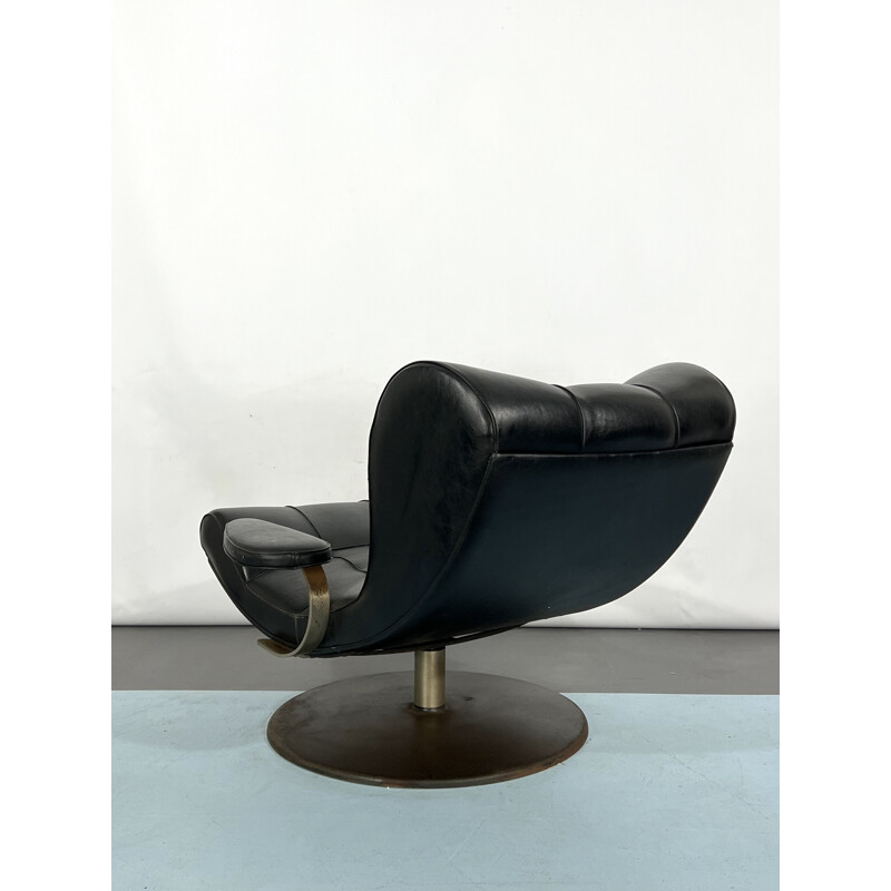 Vintage Italian black swivel armchair by Tecnisalotto, 1960