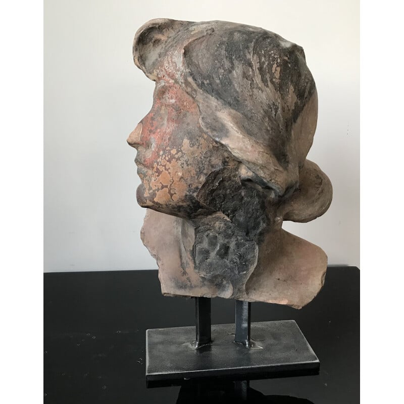 Vintage sculpture of a woman's head in terracotta