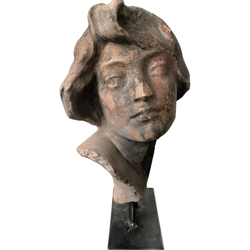 Vintage sculpture of a woman's head in terracotta