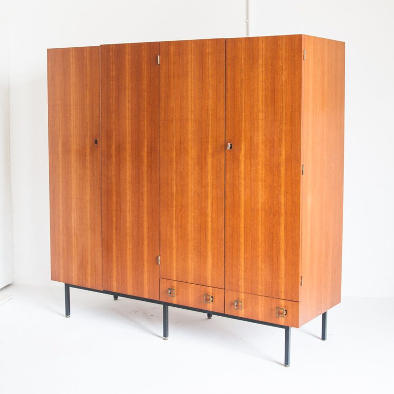 Vintage four door cabinet in teak with adjustable iron legs, France 1960