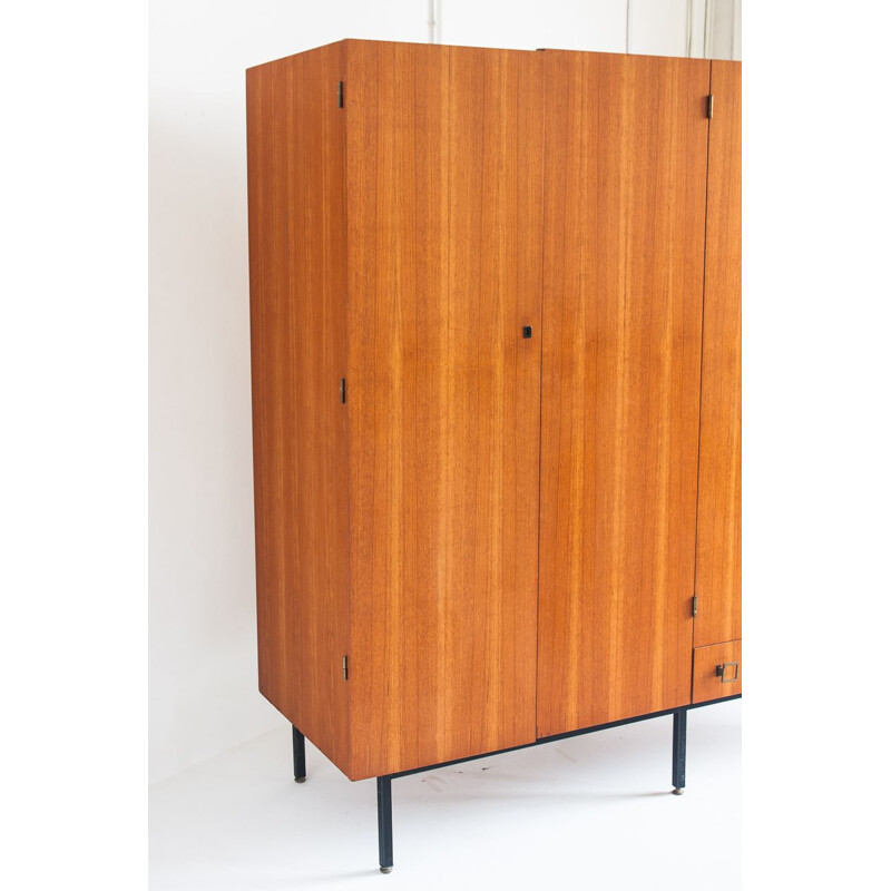 Vintage four door cabinet in teak with adjustable iron legs, France 1960