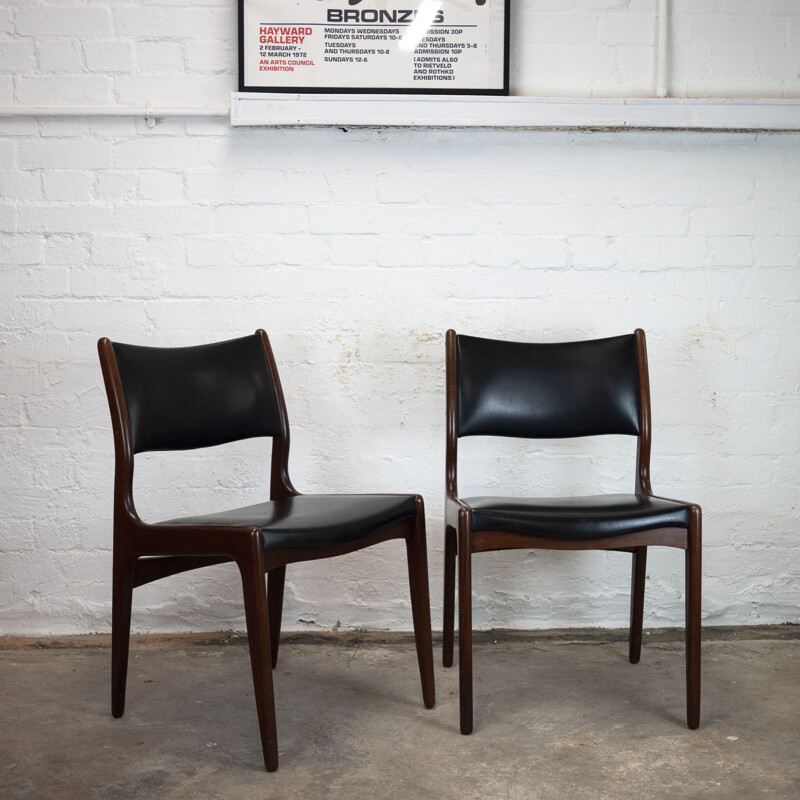 Set of 4 vintage dining chairs in teak and black vinyl by Johannes Andersen for Uldum Møbelfabrik, 1960s