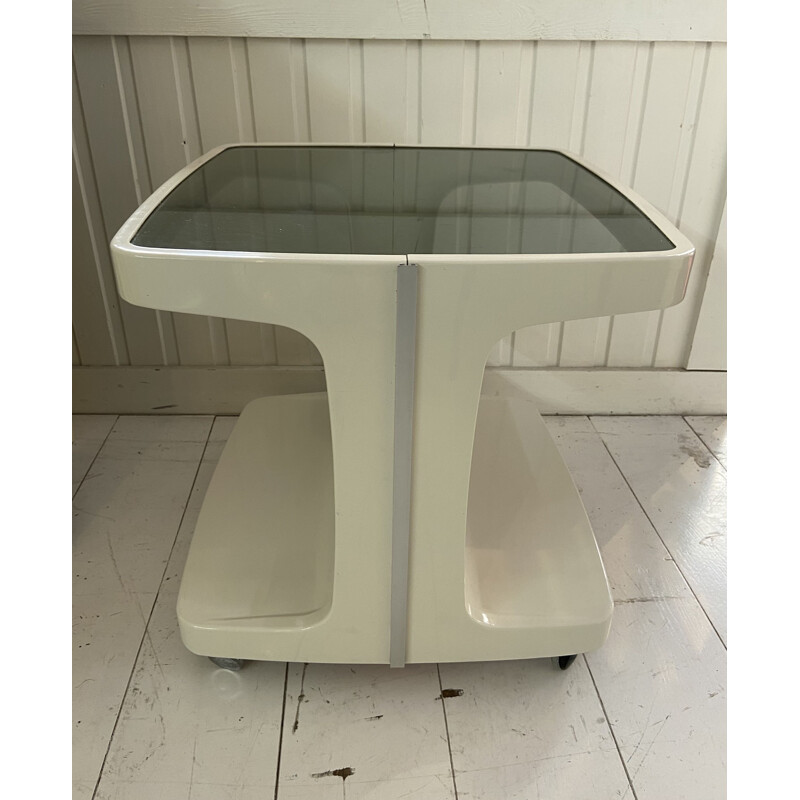 Vintage thermoformed serving table on wheels with a smoked glass top