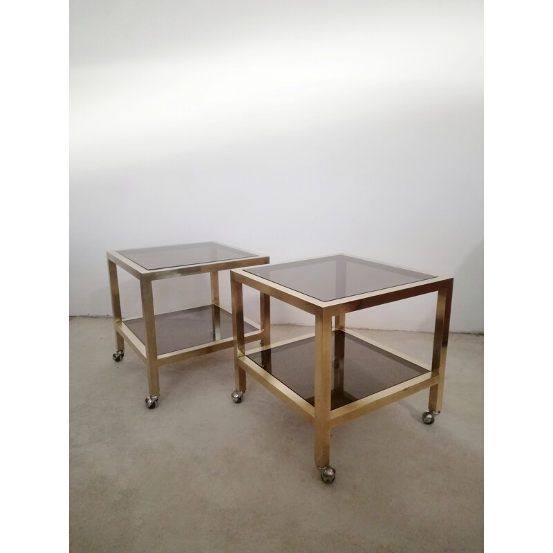 Pair of vintage brass and smoked glass side tables with casters, Italy 1970