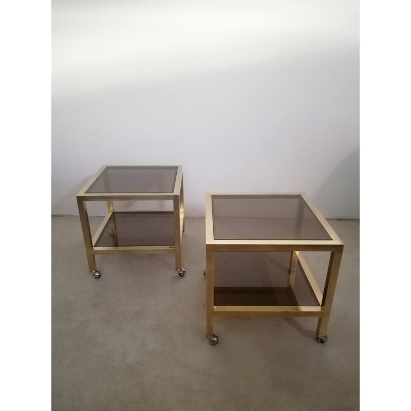 Pair of vintage brass and smoked glass side tables with casters, Italy 1970