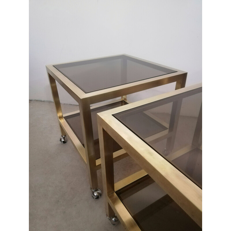 Pair of vintage brass and smoked glass side tables with casters, Italy 1970