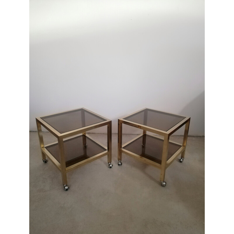 Pair of vintage brass and smoked glass side tables with casters, Italy 1970