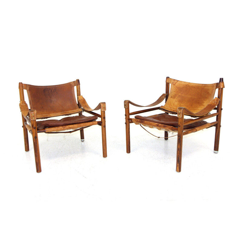 Paar vintage "sirocco" fauteuils in rozenhout en leer van Arne Norell, 1960