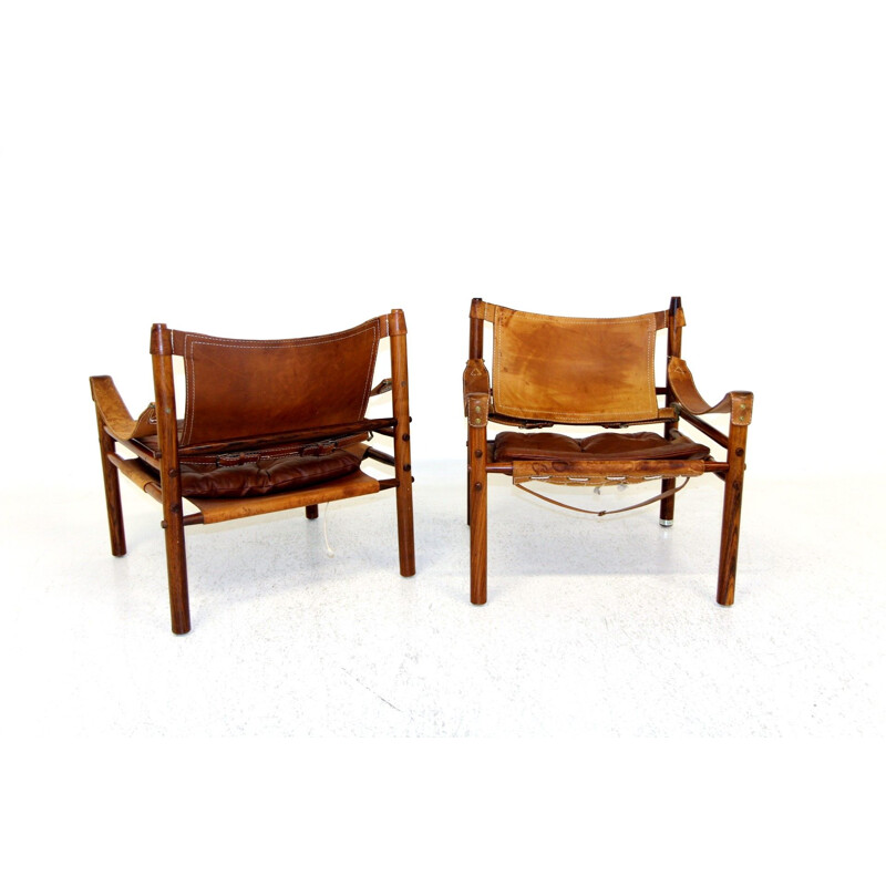 Pair of vintage "sirocco" armchairs in rosewood and leather by Arne Norell, 1960