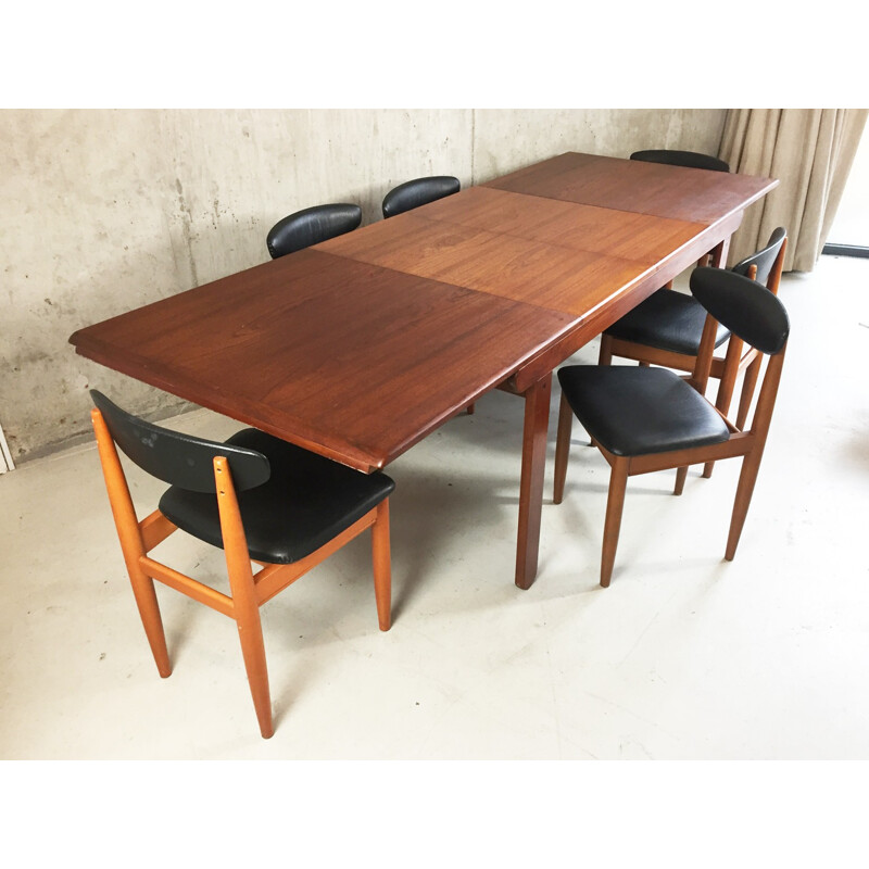 Set of extendable dining table and 6 chairs in teak and black leatherette - 1970s