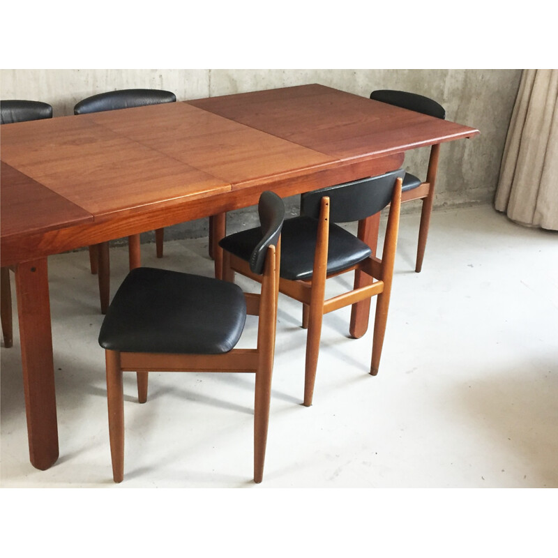 Set of extendable dining table and 6 chairs in teak and black leatherette - 1970s