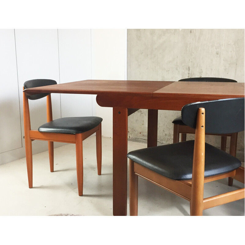 Set of extendable dining table and 6 chairs in teak and black leatherette - 1970s