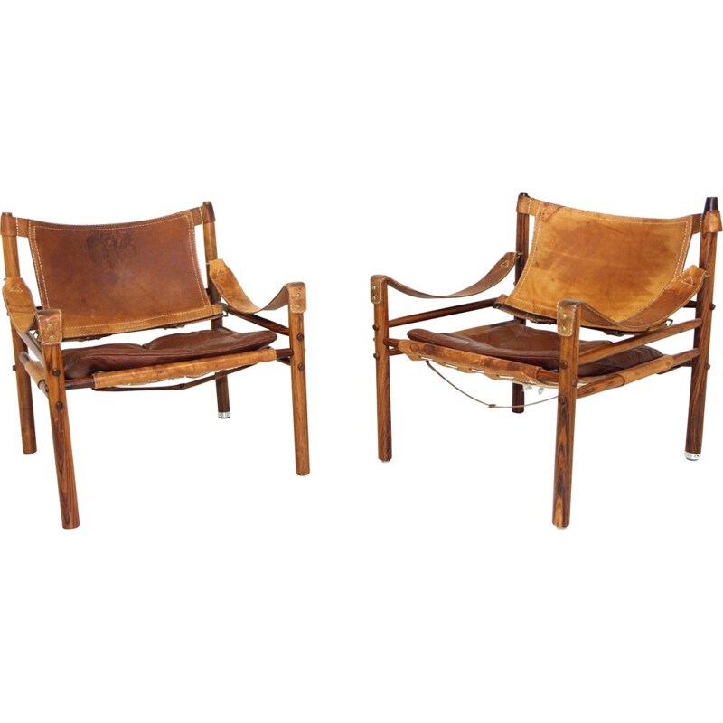 Paar vintage "sirocco" fauteuils in rozenhout en leer van Arne Norell, 1960
