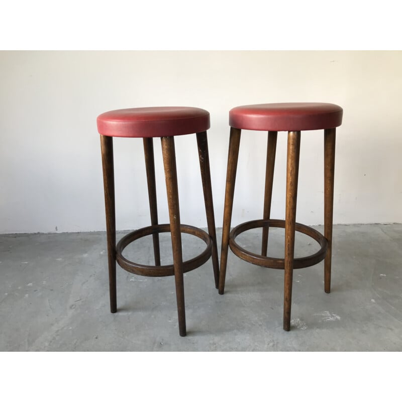 Pair of vintage bar stools in red imitation leather by Baumann