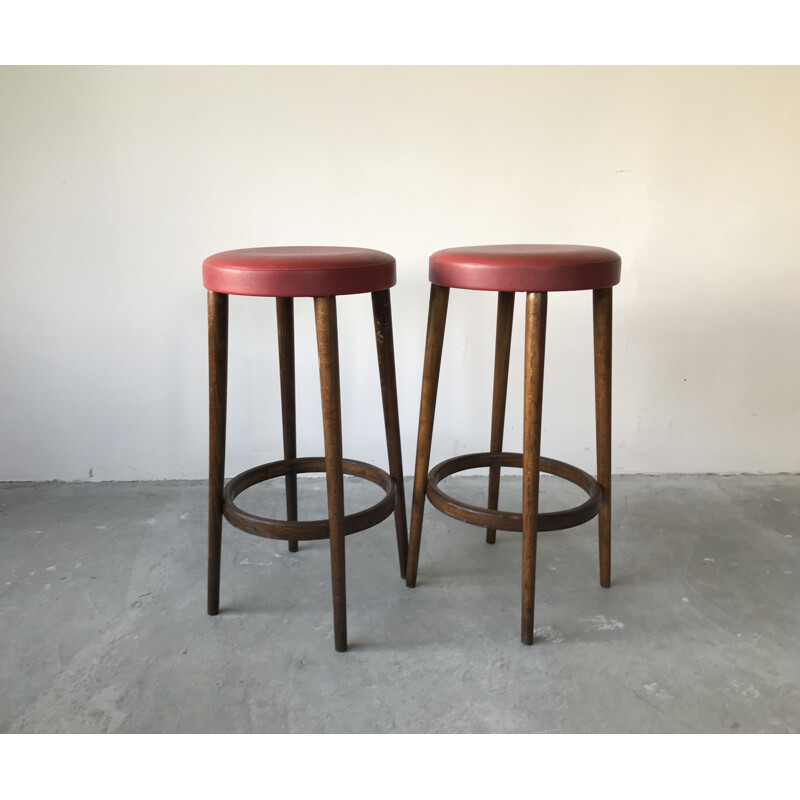 Pair of vintage bar stools in red imitation leather by Baumann