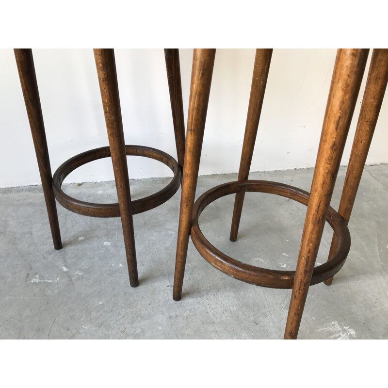 Pair of vintage bar stools in red imitation leather by Baumann