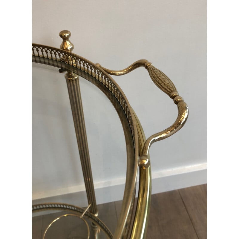 Vintage round rolling side table in brass, France 1950