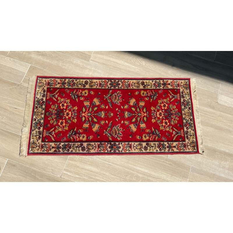 Vintage Persian rug in red wool