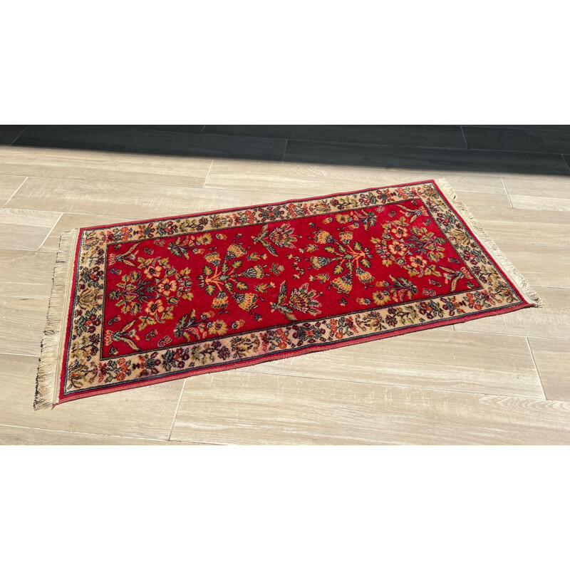 Vintage Persian rug in red wool