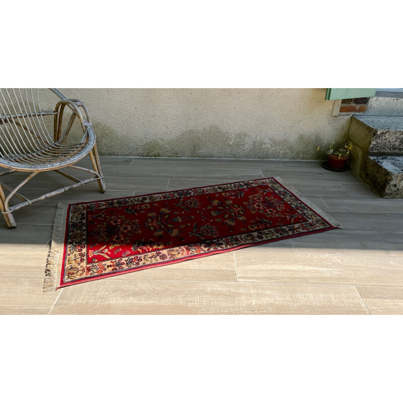 Vintage Persian rug in red wool