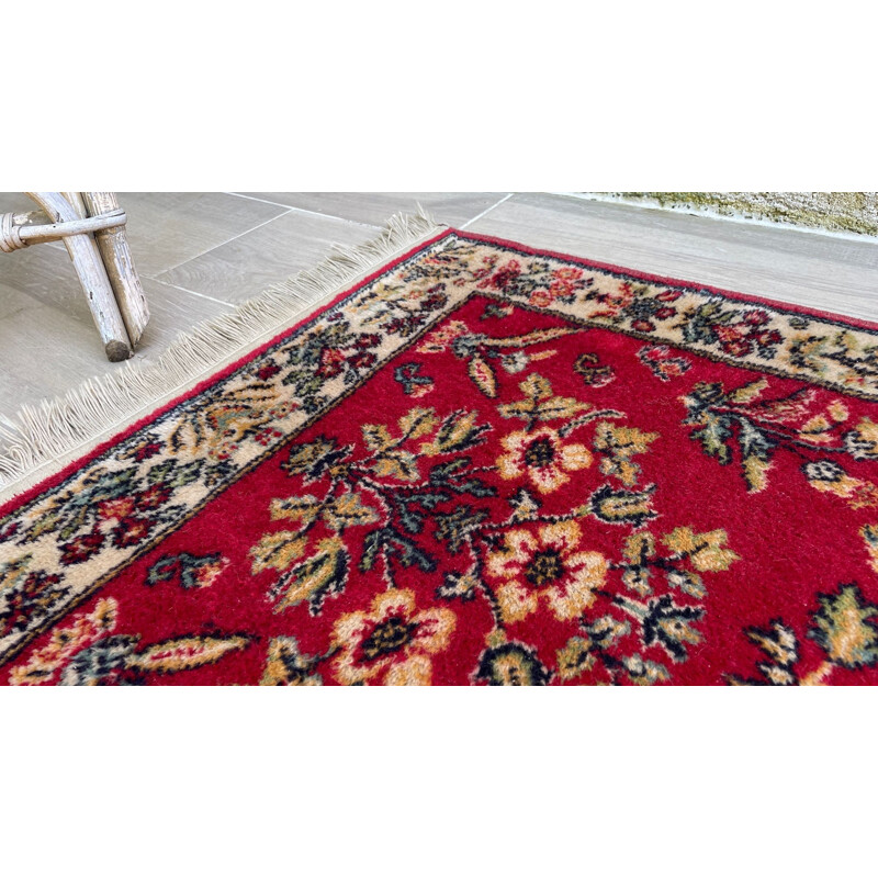 Vintage Persian rug in red wool