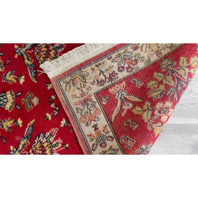 Vintage Persian rug in red wool