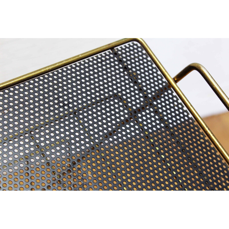 Vintage magazine rack in black perforated metal