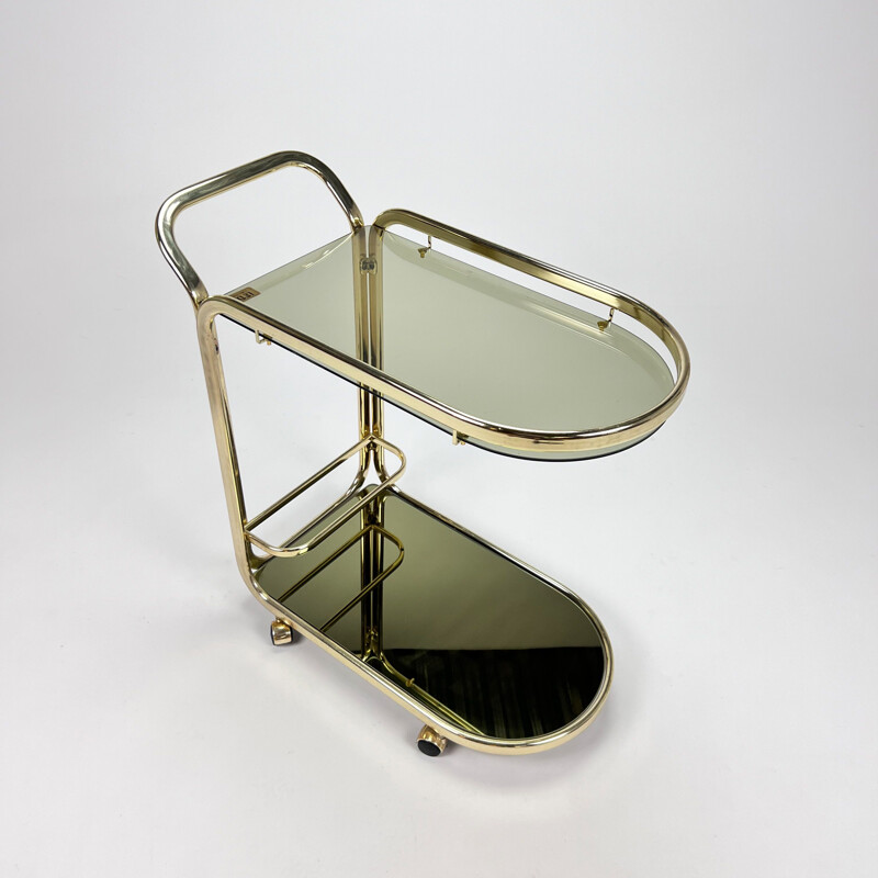 Vintage Hollywood Regency bar cart in messing en gerookt glas, 1970