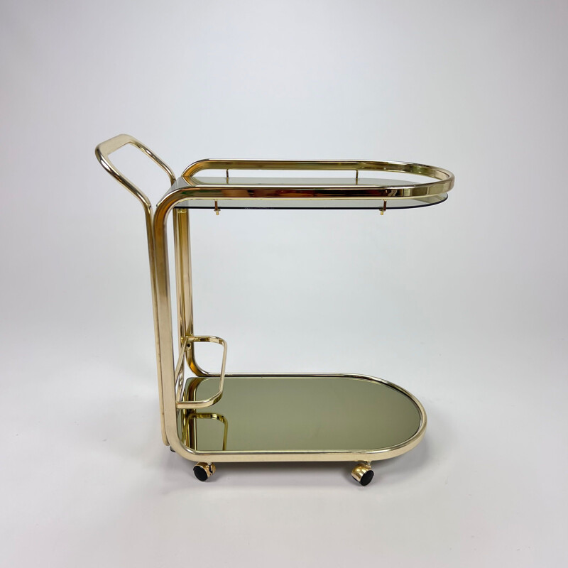 Vintage Hollywood Regency bar cart in messing en gerookt glas, 1970