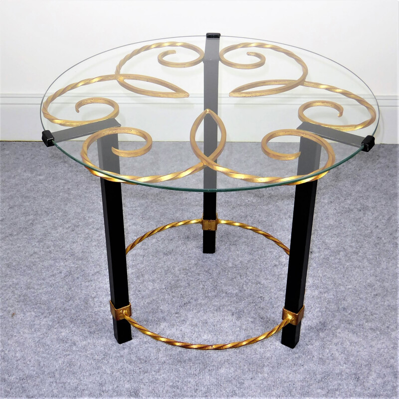 Black and gold metal pedestal table with vintage glass top, 1950