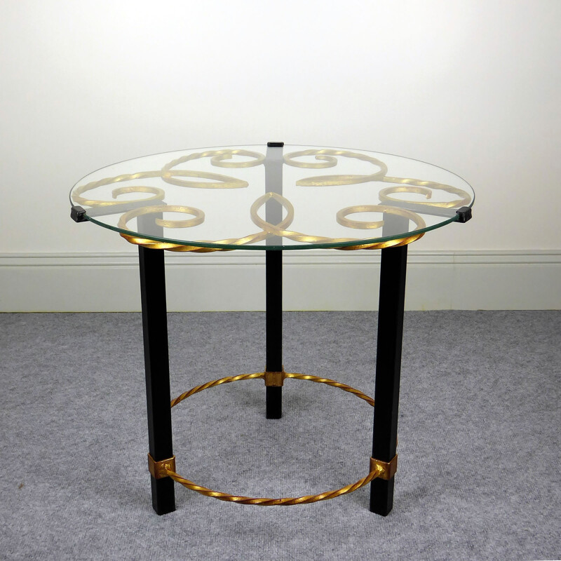 Black and gold metal pedestal table with vintage glass top, 1950