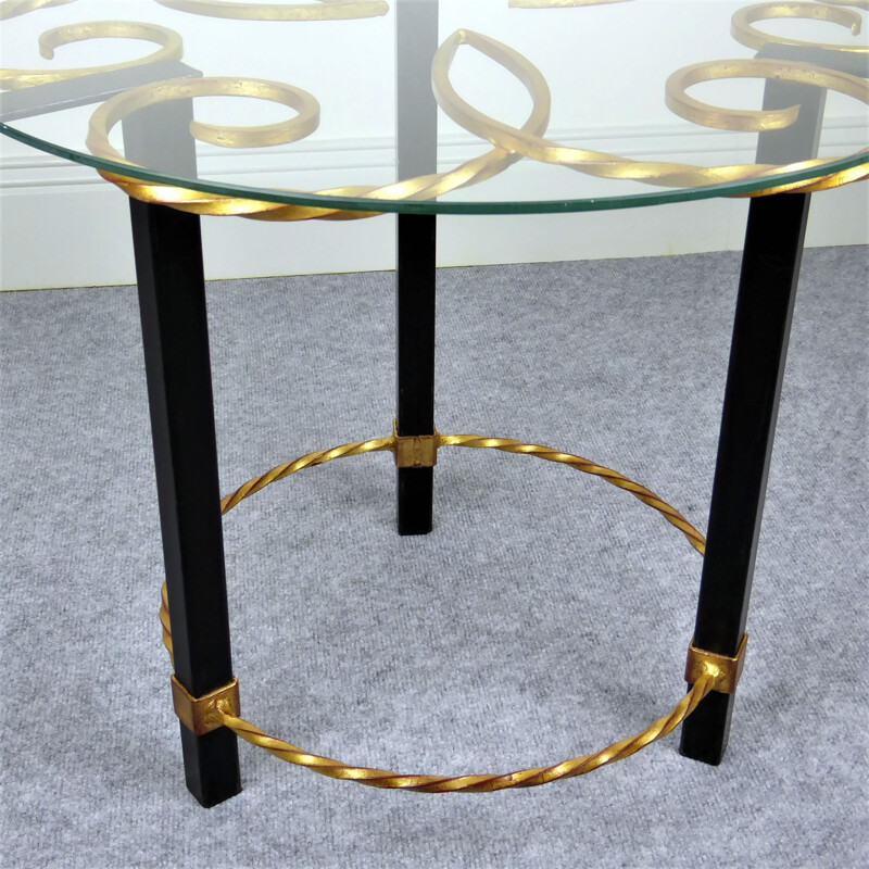Black and gold metal pedestal table with vintage glass top, 1950