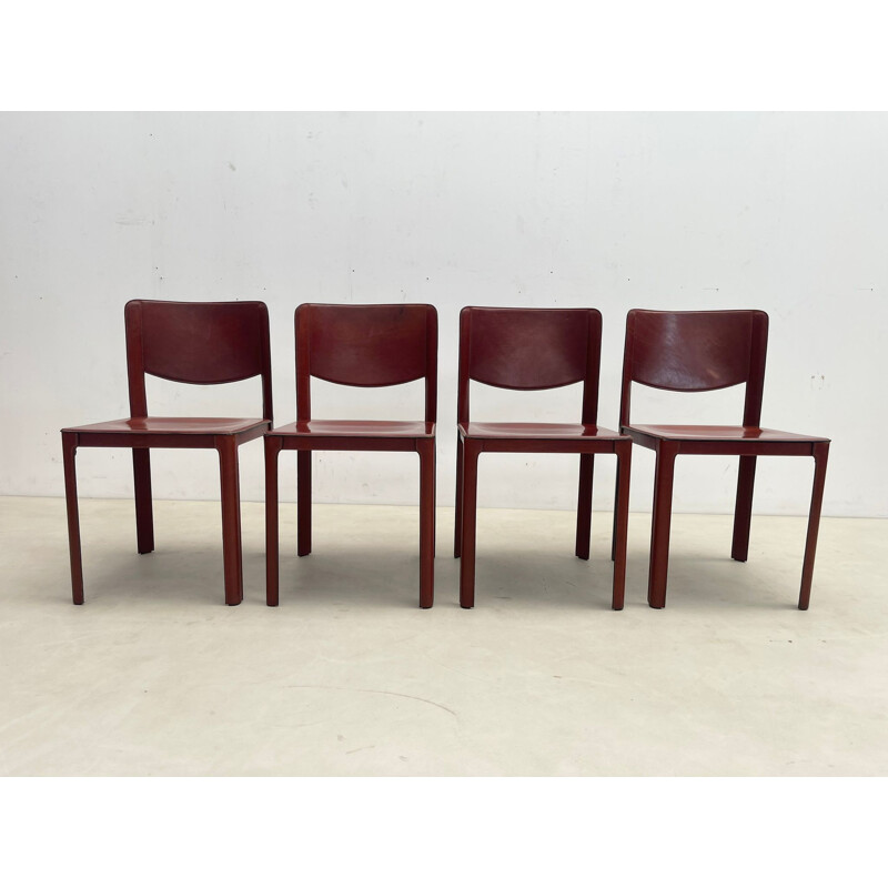 Set of 8 mid-century red leather dining chairs model "Sistina Saddle" by Tito Agnoli for Matteo Grassi, Italy 1980s