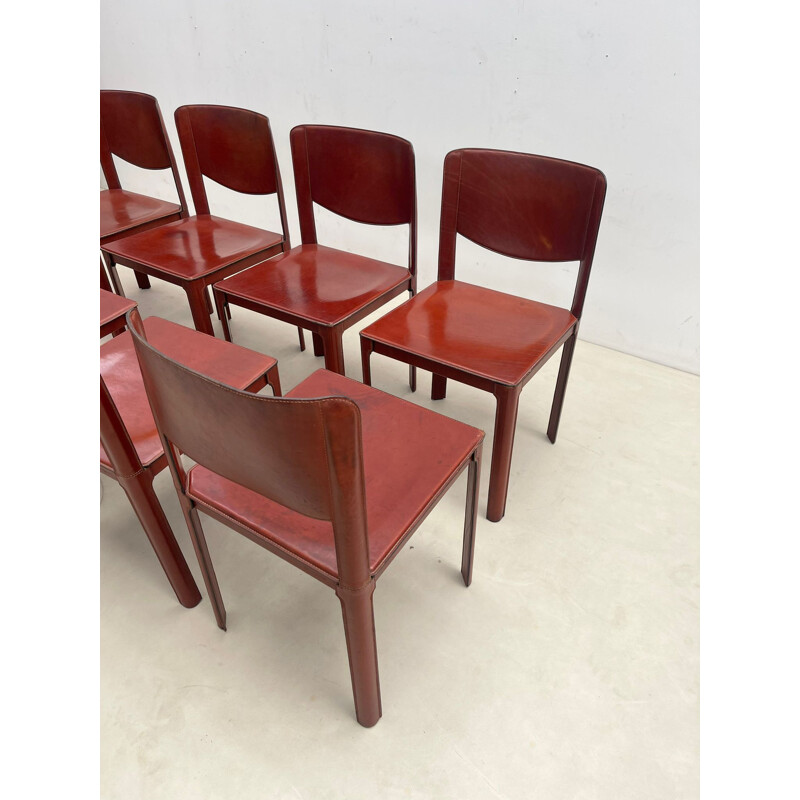 Set of 8 mid-century red leather dining chairs model "Sistina Saddle" by Tito Agnoli for Matteo Grassi, Italy 1980s