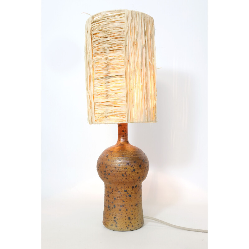 Vintage lamp in red stoneware and its shade in raffia