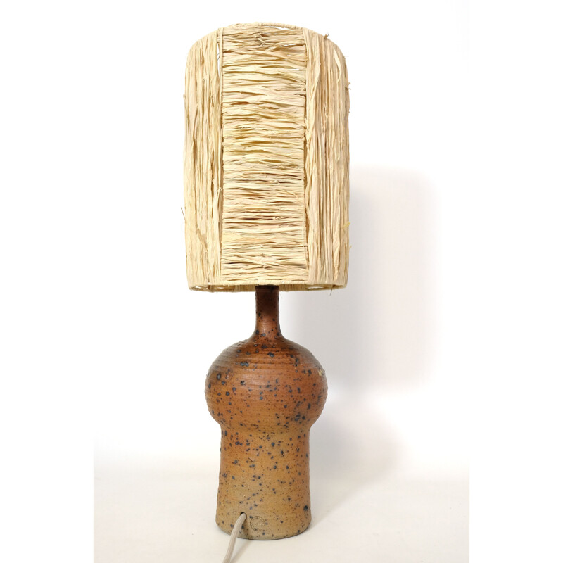 Vintage lamp in red stoneware and its shade in raffia