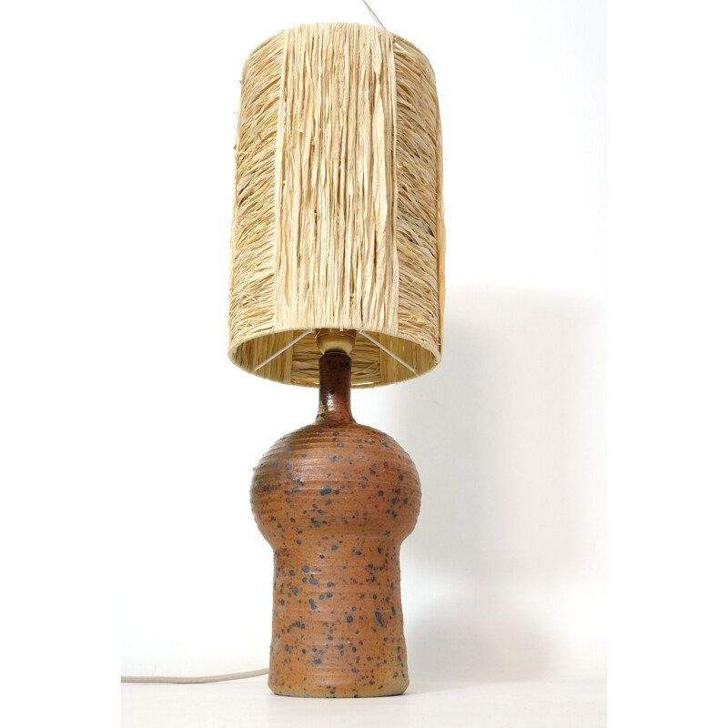 Vintage lamp in red stoneware and its shade in raffia