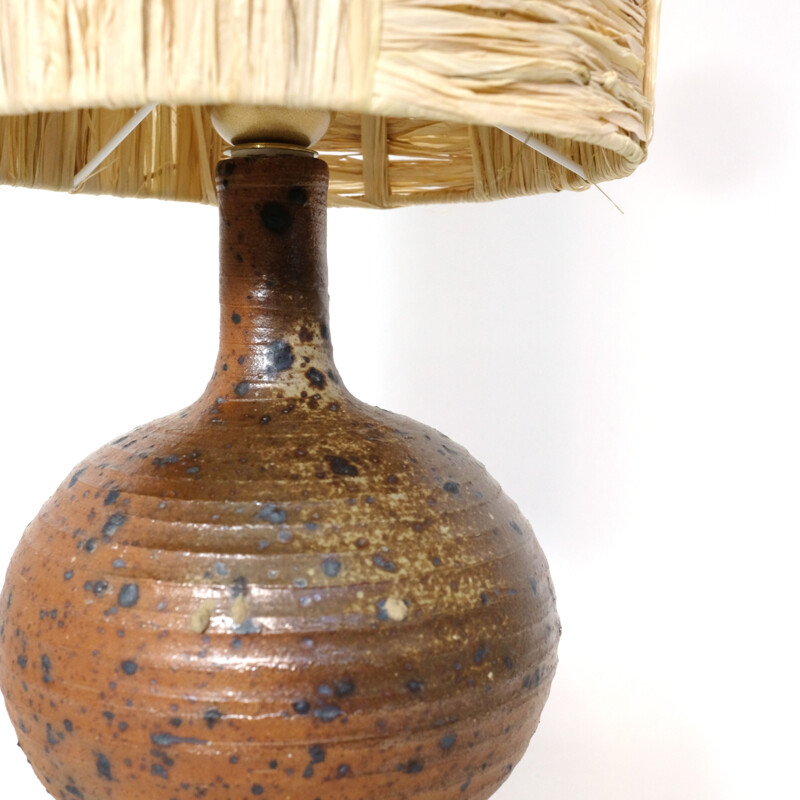 Vintage lamp in red stoneware and its shade in raffia