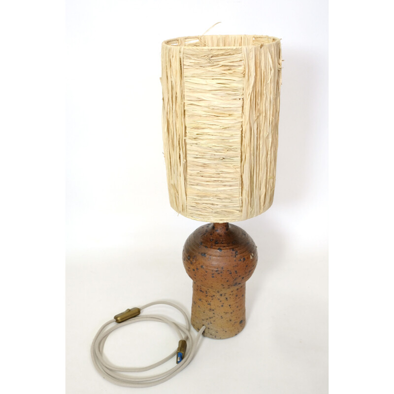 Vintage lamp in red stoneware and its shade in raffia