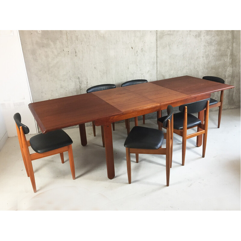 Set of extendable table and 6 chairs in teak and leatherette - 1970s