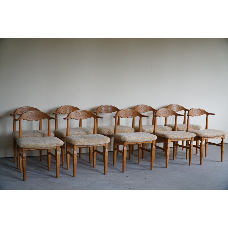 Set of 10 vintage dining chairs in oakwood and reupholstered in lambswool by Henning Kjærnulf, 1960s