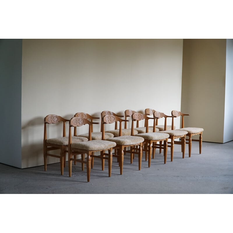 Set of 10 vintage dining chairs in oakwood and reupholstered in lambswool by Henning Kjærnulf, 1960s